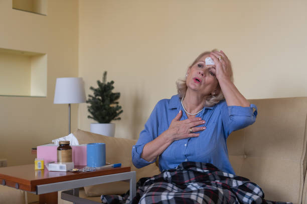 istock Sick Senior Woman Caught a Flu Virus, has a High Temperature and Sweating. 1307155233