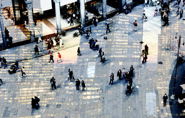 istock Abstract image of people walking on a street. 1307155354