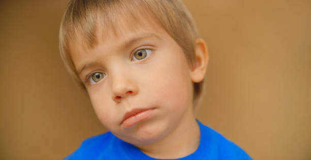 istock Close-up of sad schoolboy 1307159041