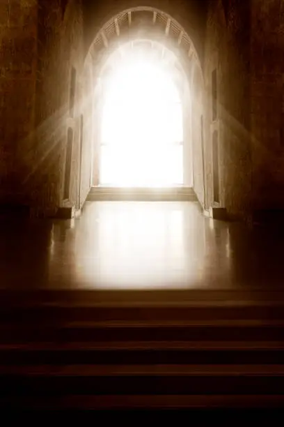 Photo of Church Interior. Window Light in Dark Indoors. Shining Door in front Empty Steps. Mystery Background