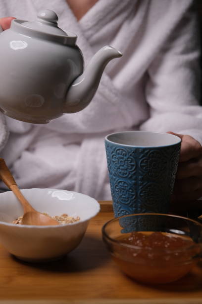 istock Mature woman is having breakfast in bed 1307161230