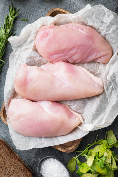 istock Crispy garlicky chicken raw ingredients on grey background, flat lay 1307161443