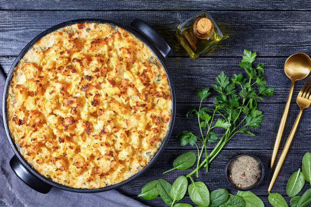 salmon pot pie with smoked haddock, prawns, spinach, topped with potato mash in a baking dish, english cuisine salmon pot pie with smoked haddock, prawns, spinach, topped with potato mash in a baking dish, english cuisine haddock stock pictures, royalty-free photos & images