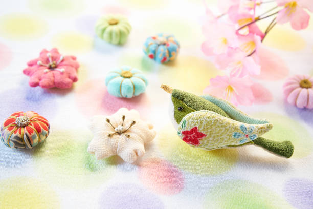 colorfull and small Japanese fabric flower and bird colorfull and small Japanese fabric flower and bird mairimashita iruma stock pictures, royalty-free photos & images