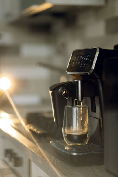 istock Coffee machine is preparing americano in domestic kitchen 1307161830