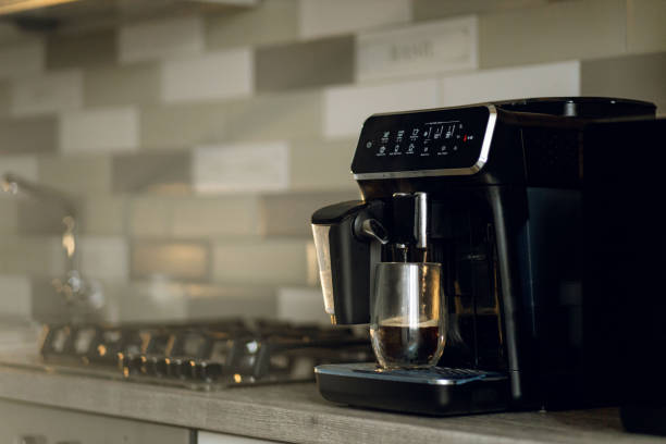 istock Coffee machine is preparing americano in domestic kitchen 1307161840