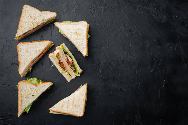 istock Classic club sandwich, on black background, top view with copy space for text 1307162572