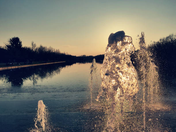 istock Water stream splashing on the ground with romantic sunset 1307163048