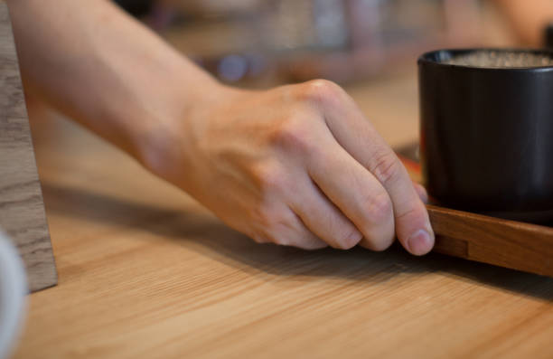 istock man or bartender serving customer at coffee shop 1307163060