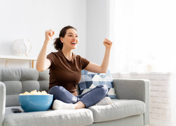 istock Young woman watching  TV 1307166720