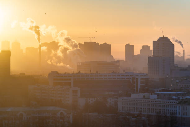 Dawn over the city. The sun illuminates the smog over the city stock photo
