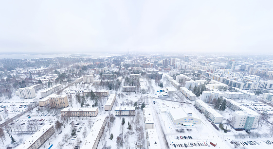 Aerial panoramic view of Matinkyla neighborhood of Espoo, Finland. Snow-covered city in winter.