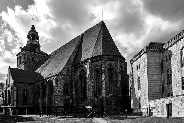 istock Medieval, gothic church with a belfry in Osno 1307180214