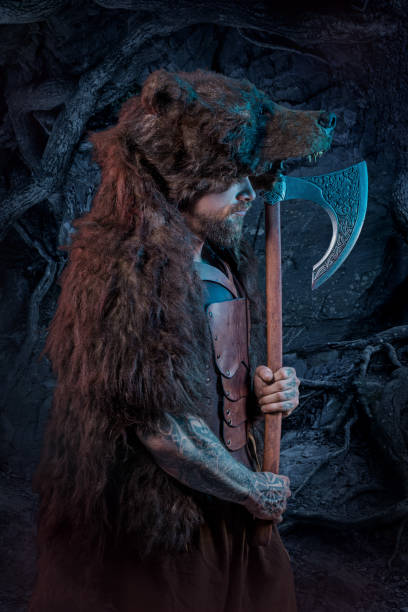 istock Viking warrior berserker in bear skin in studio shot 1307180962