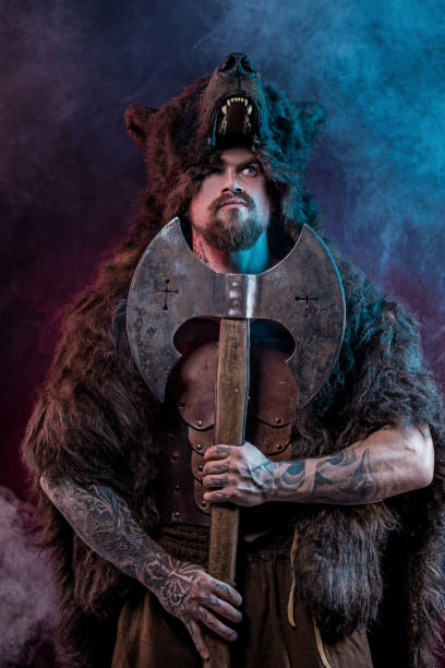 istock Viking warrior berserker in bear skin in studio shot 1307181318