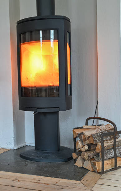 istock piled wood beside a fire place indoors 1307182532