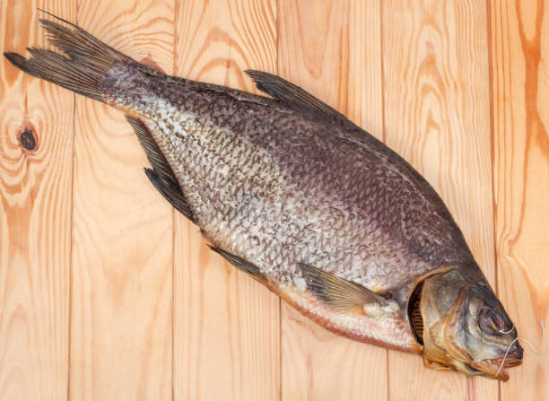 istock Salted and dried bream on a wooden surface 1307183794