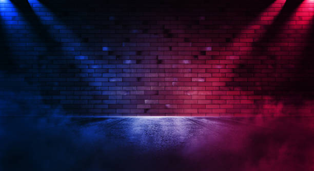 istock Neon scene empty with smoke and spotlight on  wall. Rays neon light in the dark with  smoke. 1307183946