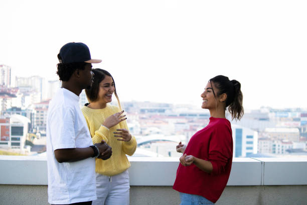 istock Multi-ethnic group of young people on a rooftop party 1307185486