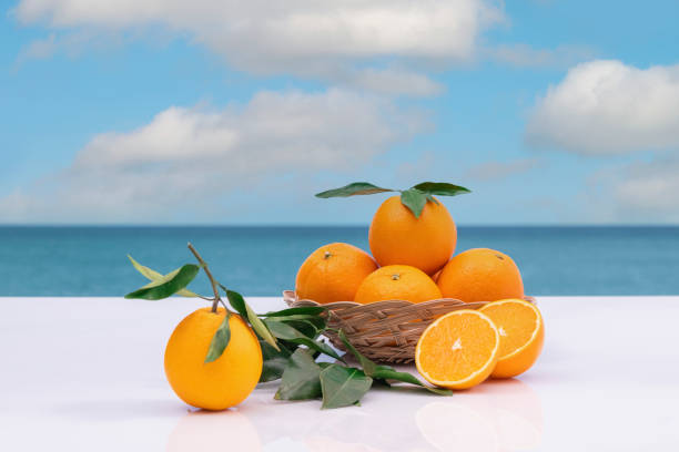 istock view of fresh oranges in a basket with leaves 1307185590