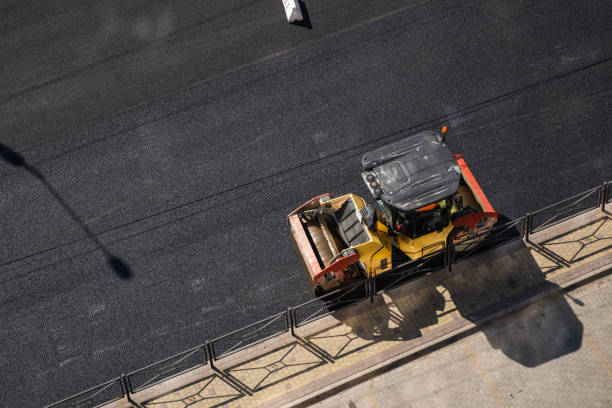 istock Asphalt road roller with heavy vibration roller compactor press new hot asphalt on the roadway on a road construction site. Heavy Vibration roller at asphalt pavement working. Repairing. 1307185656