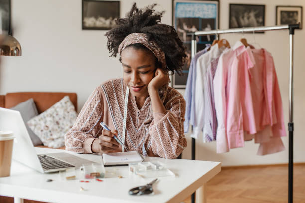 istock Young female designer works in her apartment 1307188636