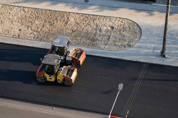istock Asphalt road roller with heavy vibration roller compactor press new hot asphalt on the roadway on a road construction site. Heavy Vibration roller at asphalt pavement working. Repairing. 1307188830