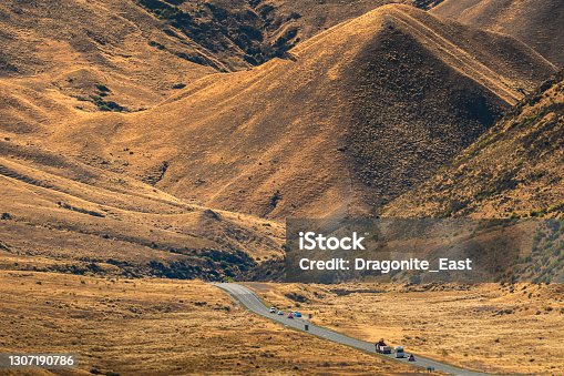 istock State Highway at Lindis Pass, the highest point on the South Island, connecting Central Otago with the Mackenzie Basin, NewZealand 1307190786