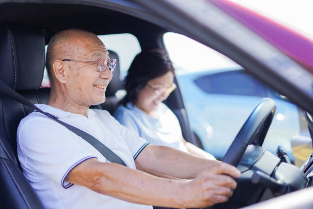 istock Senior couple driving a car 1307191857