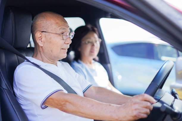 istock Senior couple driving a car 1307191858