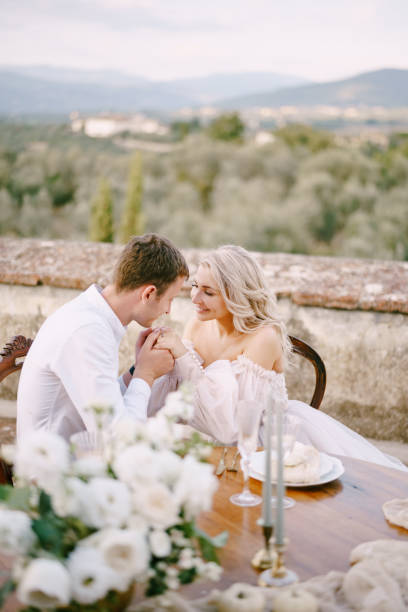 istock Happy Couple Sitting At Outdoors Cafe 1307192487