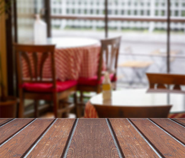istock wooden floor in front of blurred cafe background 1307193084