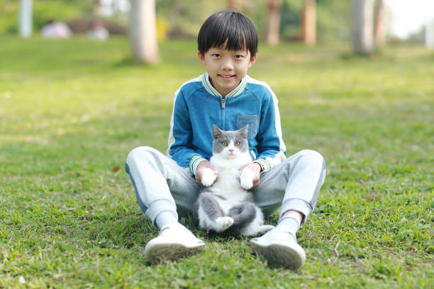 istock Cute young boy snuggles his kitten. 1307194101