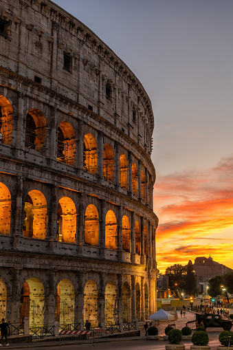 The Colosseum in city of Rome at sunset in Italy, ancient Flavian Amphitheatre and Gladiators stadium.
