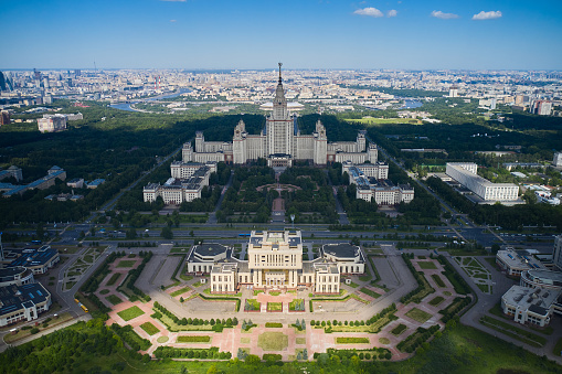 Aerial panoramic view of the Moscow State University and University library and shadow of clouds. Urban city skyline on sunny background