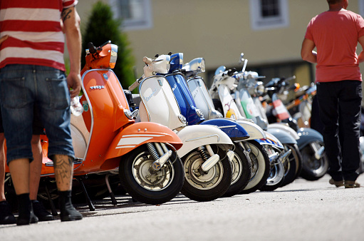 Many motorcycles in a row at a Vespa meeting in Vorchdorf, Salzkammergut, Austria, Europe