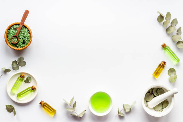istock Herbal medicine natural cosmetics. Eucalyptus leaves in white mortar, top view 1307197714