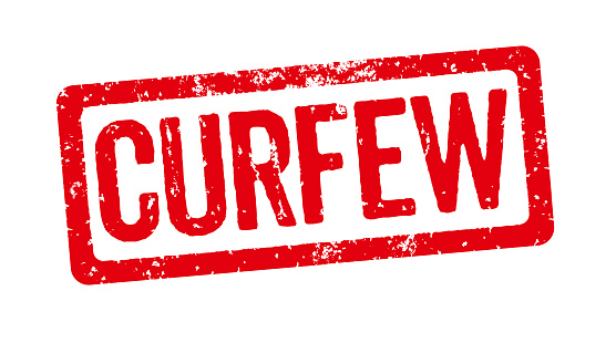 Red stamp on a white background - Curfew