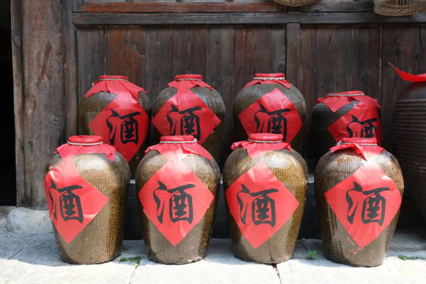 close up many traditional Chinese wine jars. Chinese character translation is wine