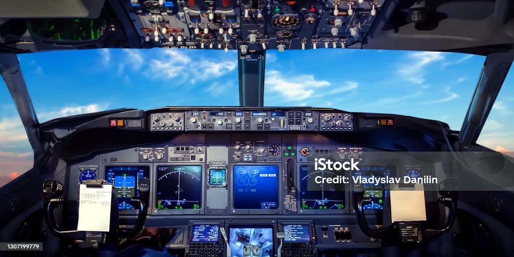 Cockpit pilot flight jet display Cockpit pilot Flight Deck display. Throttle jet cabin with control panel plane. View in windows blue sky clouds Cockpit Stock Photo