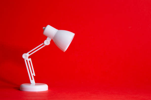 istock Desk lamp on red background, Idea Conceptual 1307200123