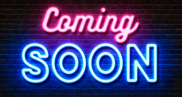 Neon sign on a brick wall - Coming soon