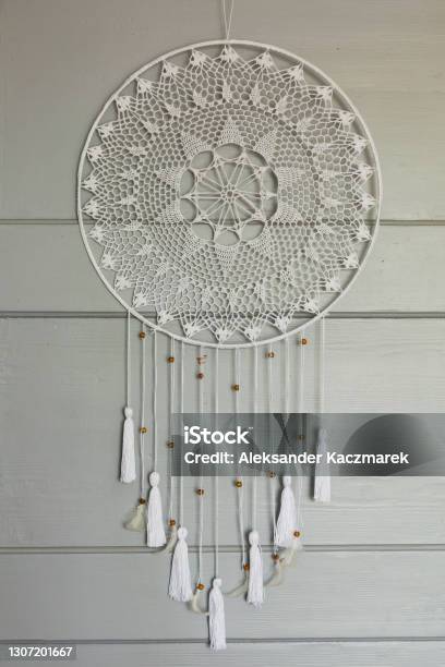 Lacy Dream Catcher Hanging On A Gray Door Stock Photo - Download Image Now - Art, Boho, Circle