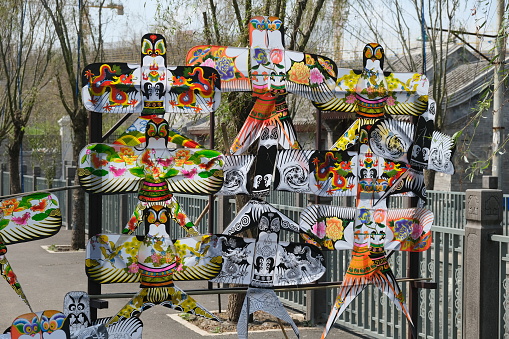 Haikou.China-March 2021: various colorful traditional Chinese kites on street stall. Beautiful Chinese kite