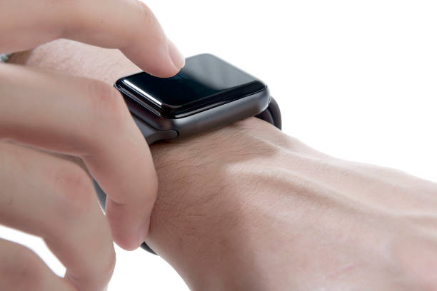 istock Smart watch being worn on a boy's left wrist isolated on white background 1307203469