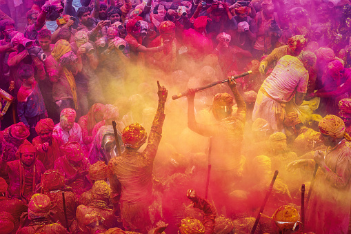People throw colours at each other during the Holi celebration at Krishna temple on March 05, 2020, in Nandgaon, India.  Holi is the most celebrated religious festival in India.