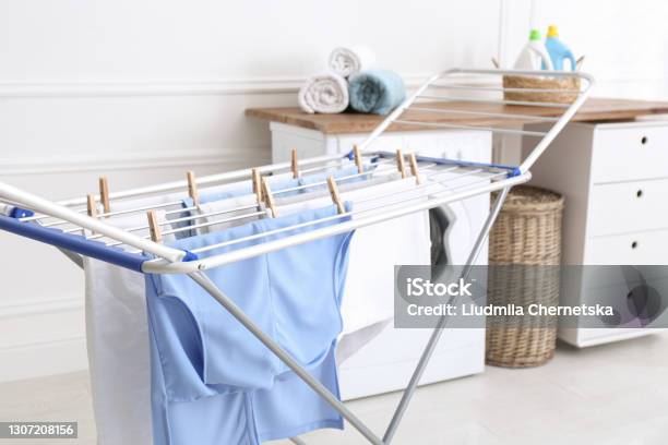 Clean Laundry Hanging On Drying Rack Indoors Stock Photo - Download Image Now - Clothesline, Laundry, Drying