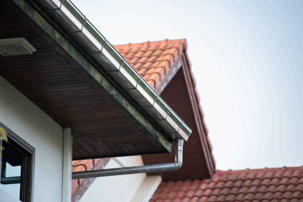 istock stainless steel rain gutter on top of roof. 1307209209