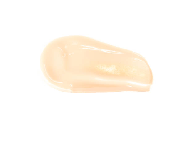 istock Make-up foundation smear smudge, cream texture, cosmetic background, liquid consistency skin care, colored cream 1307210429