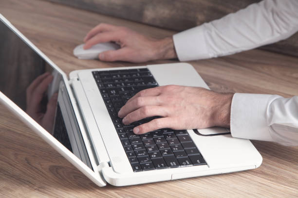 istock Businessman using laptop in office. 1307210615